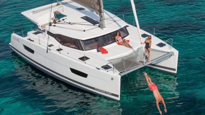 People jumping off the catamaran, enjoying their charter in Phuket.